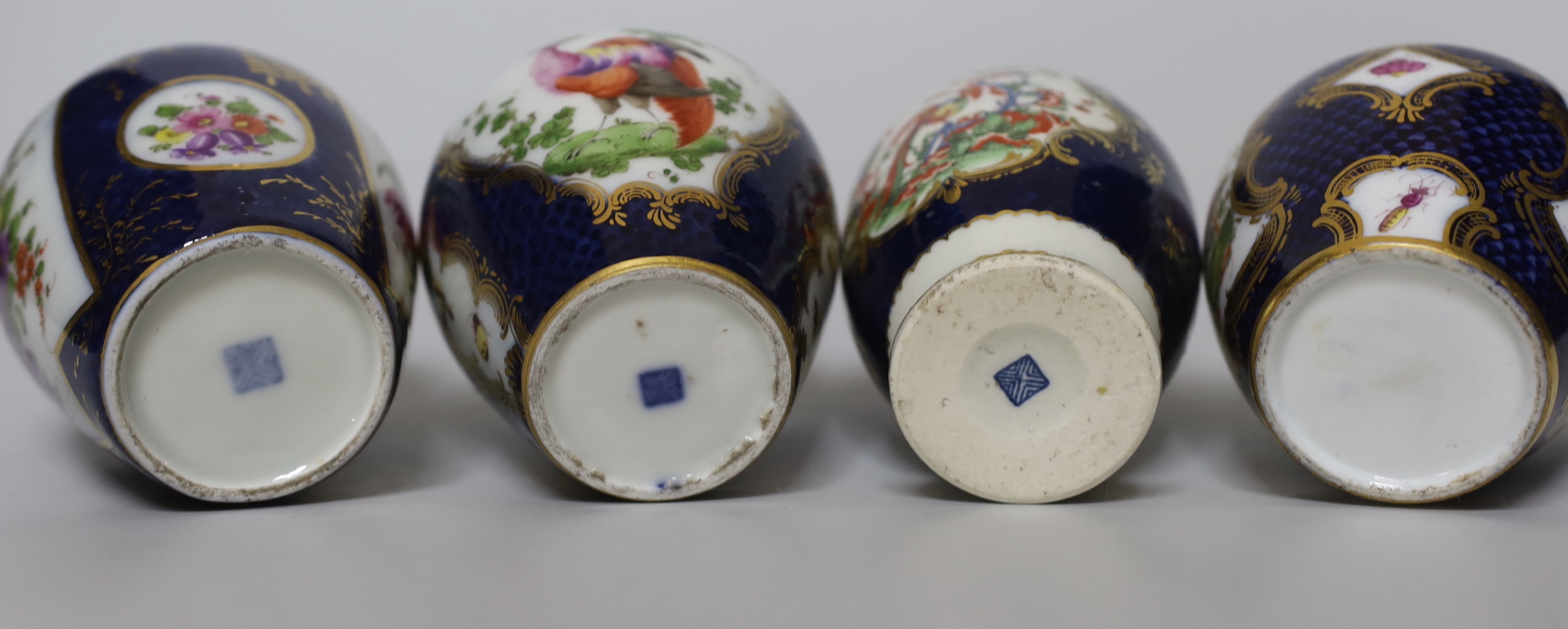 A group of Paris porcelain tea canisters in imitation of Worcester and Sevres, tallest 13.5cm, together with a Worcester Kakiemon pattern scale blue tea canister a/f